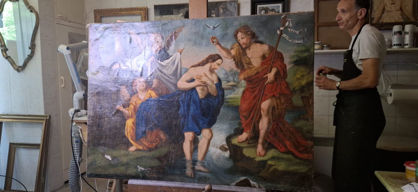 Restauration de tableaux — la toile restaurée dans l'atelier
